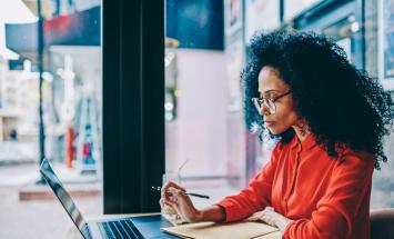 Person at a desk with laptop