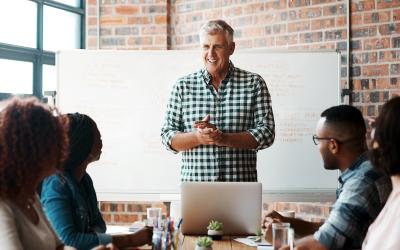 Man leading a discussion with his colleagues